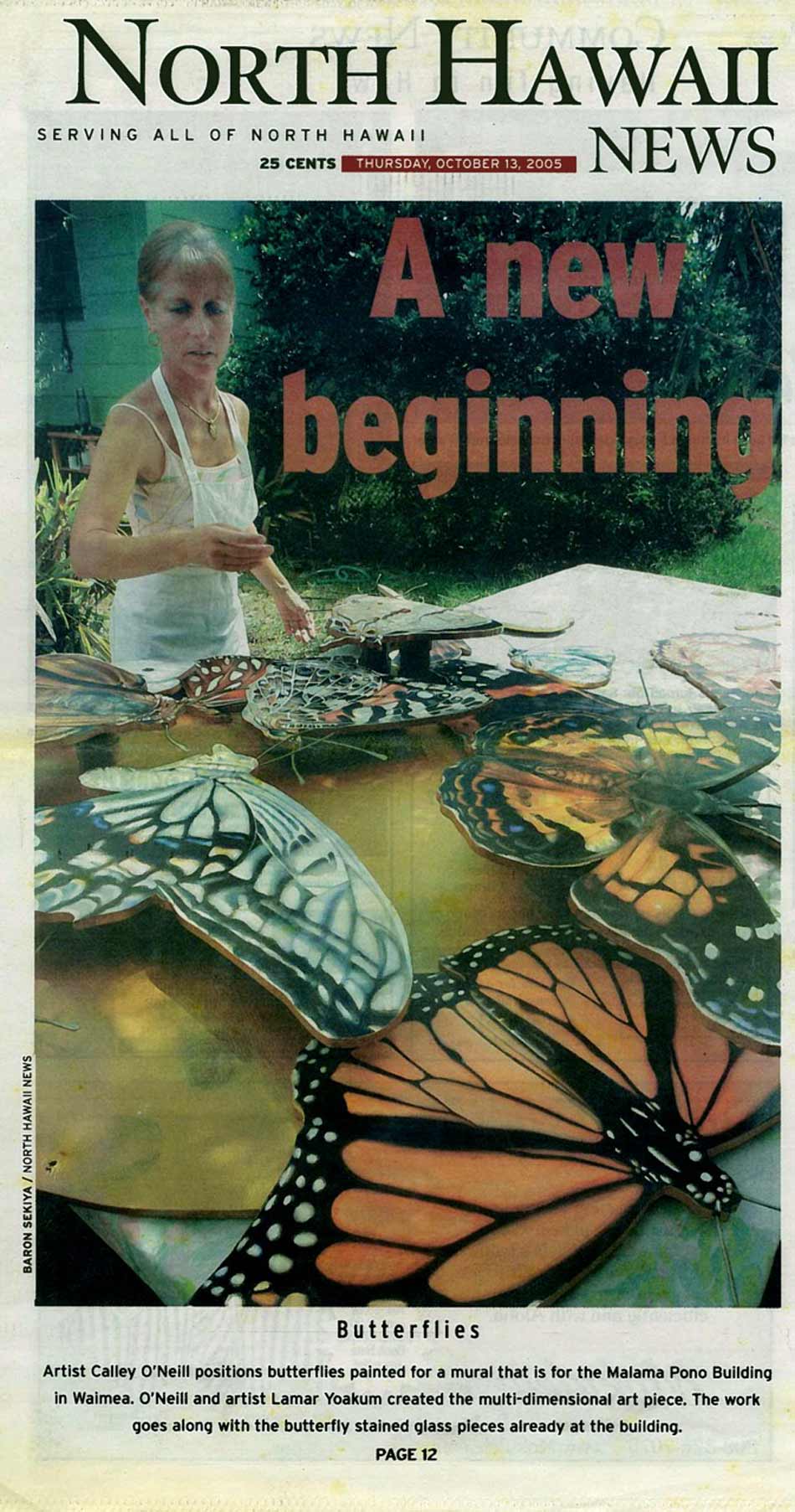 Artist Calley O'Neill positions butterflies painted for a mural that is for the Malama Pono Building in Waimea.  O'Neill and artist Lamar Yoakum created the multi-dimensional art piece.  The work goes along with the butterfly stained glass pieces already at the building.
