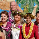 Calley with models and dignitaries.